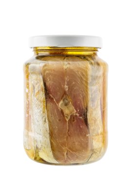 Glass jar of salted mackerel fish in soya bean oil isolated on w