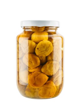Salted plum in glass jar isolated on white background