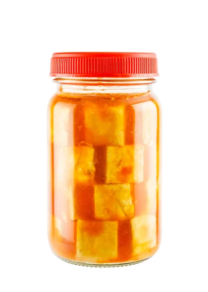 Preserved bean curd with chili in glass jar isolated on white ba — Zdjęcie stockowe