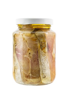 Glass jar of salted mackerel fish in soya bean oil isolated on w