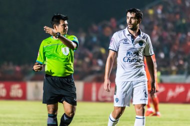 SISAKET THAILAND-OCTOBER 15: The referee (green) in action durin