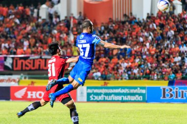 SISAKET THAILAND-AUGUST 12: Thiago Cunha of Chonburi FC (blue) i