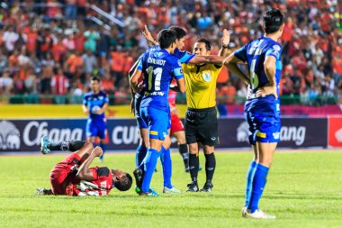 SISAKET THAILAND-AUGUST 12: The referee (yellow) in action durin