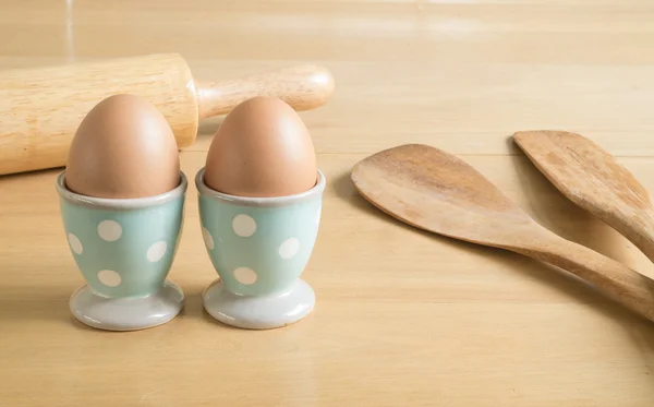 Two eggs and baking utensils — Stock Photo, Image