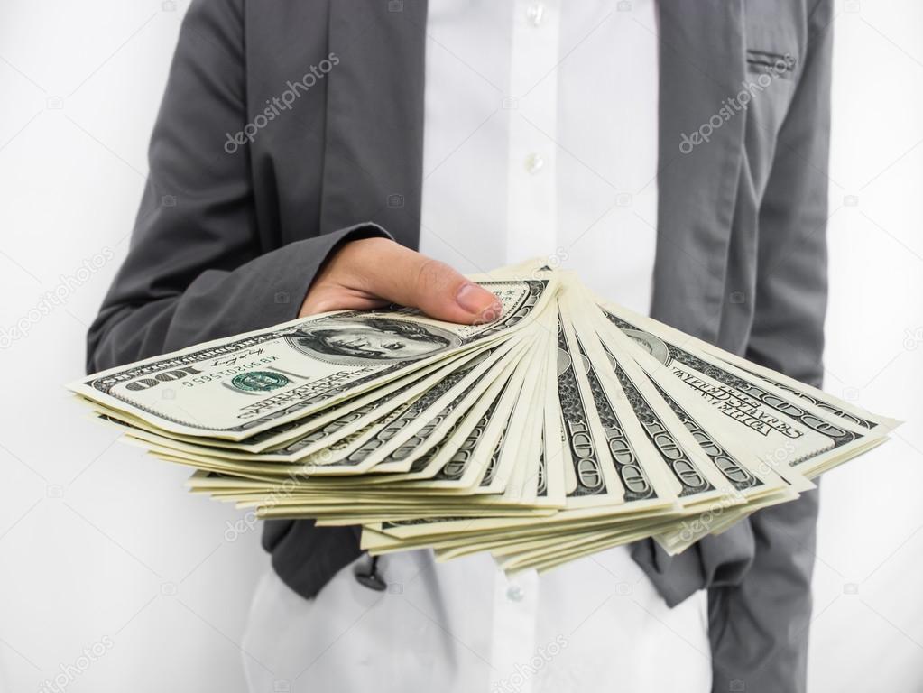 Businessman Displaying Spread of Cash