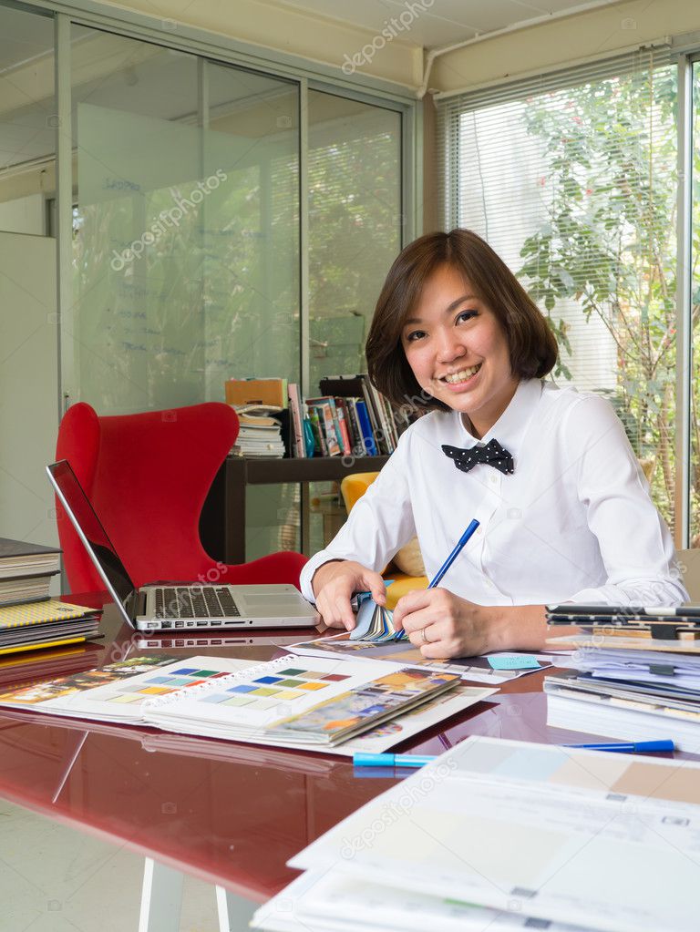 Portrait of Asian woman interior designer working