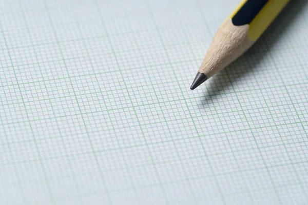 pencils on graph paper, research science and education concept