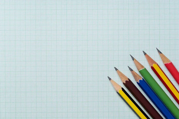 pencils on graph paper, research and education concept