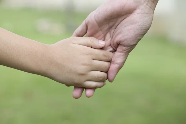 Hands of mother and son — Stock Photo, Image