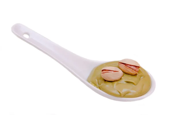 阿月浑子乳膏的勺子 — 图库照片
