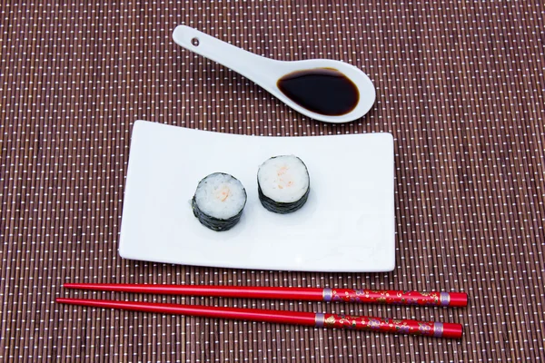 Maki with prawns on bamboo seen from above — Stock Photo, Image