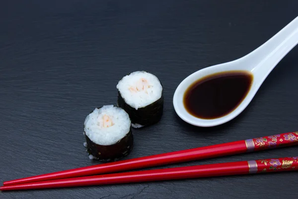 Maki with shrimps on slate seen up close — Stock Photo, Image