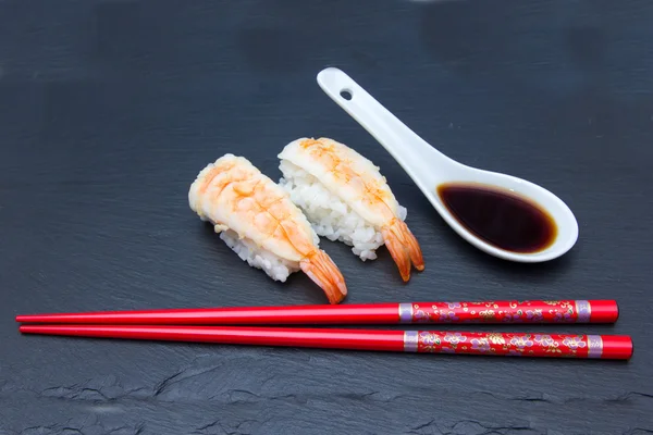 Nigiri with shrimp on slate — 图库照片