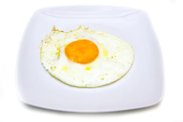 Fried egg on plate — Stock Photo, Image