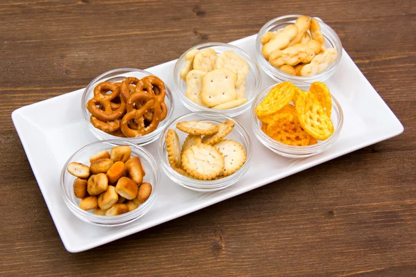 Bowls of pretzels on tray — Stock Photo, Image