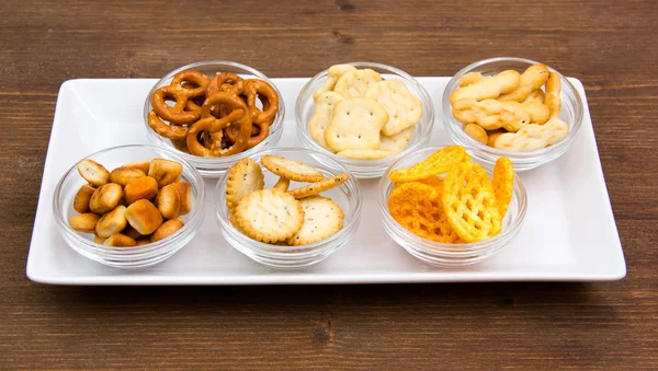 Pretzels on tray on wood — Stock Photo, Image