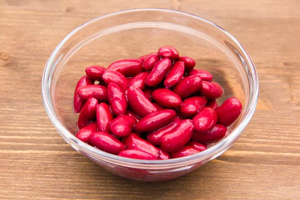 Red beans on the bowl on wood — Stock Photo, Image