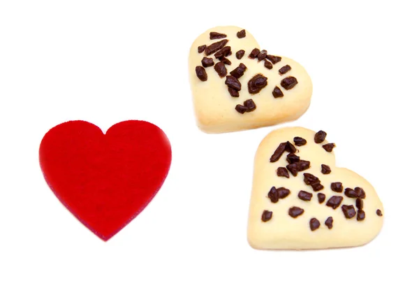 Biscoitos e coração vermelho — Fotografia de Stock
