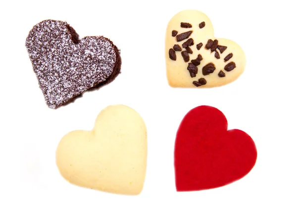 Bolos e biscoitos na forma de coração perto — Fotografia de Stock