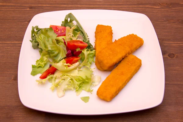 Fish sticks on wood — Stock Photo, Image