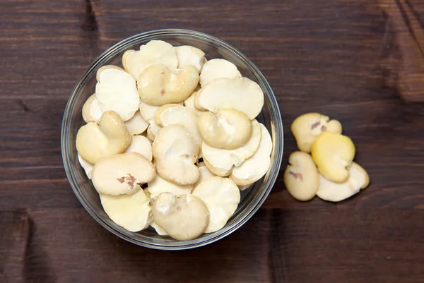 Dried beans inside bowl on wood from above — Stock Photo, Image