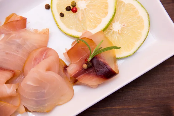 Smoked swordfish on tray on wood seen from above and very close — Stock Photo, Image