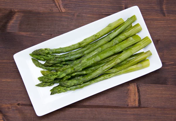 Asparagus over wooden tray on top — Stock Photo, Image