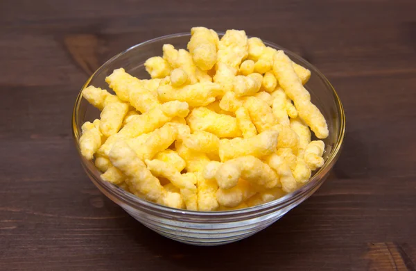 Corn snack on cheese bowl on wood — Stock Photo, Image