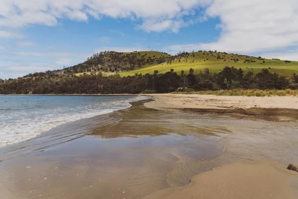 Seven Mile beach a pristine golden sand beach just outside of the city of Hobart in Tasmania, Australia shot on an overcast spring day