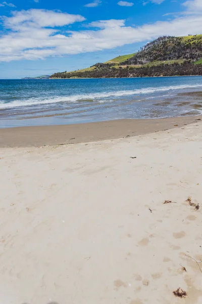 Seven Mile beach a pristine golden sand beach just outside of the city of Hobart in Tasmania, Australia shot on an overcast spring day