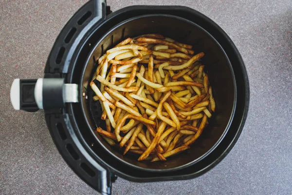 simple food ingredients concept, french fries cooked in an air fryer