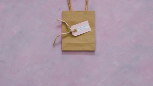 Women Owned Business Tag Shopping Bag Supporting Equality — Stock Video