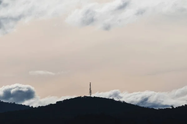 beautiful sky with clouds rolling over the mountains in Tasmania, Australia with contrasty tones