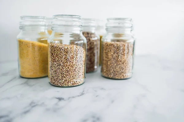 Clear Pantry Jars Different Types Grains Them Including Quinoa Rice — Stock Photo, Image