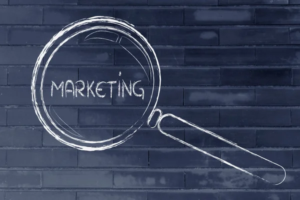 Magnifying glass focusing on marketing and communication — Stock Photo, Image