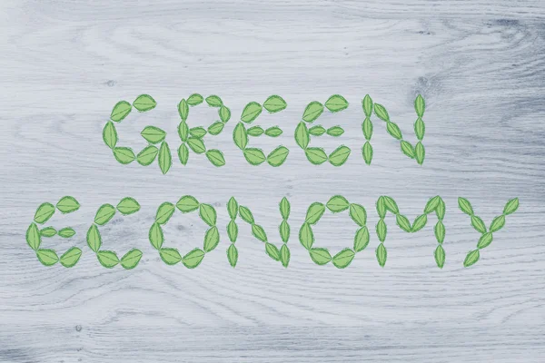 Green economy writing made of leaves — Stock Photo, Image