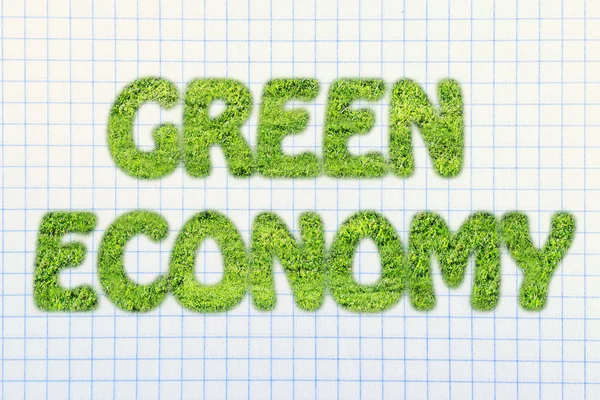 Green economy writing made of grass texture — Stock Photo, Image