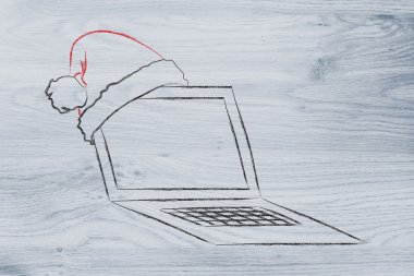 Santa claus şapka, Noel alışveriş online kavramı ile bilgisayar
