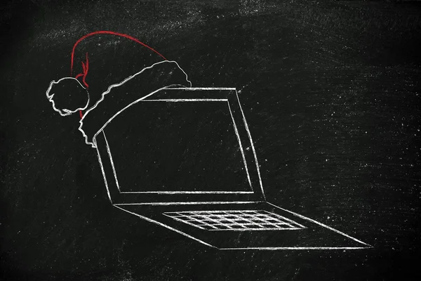 Santa claus şapka, Noel alışveriş online kavramı ile bilgisayar