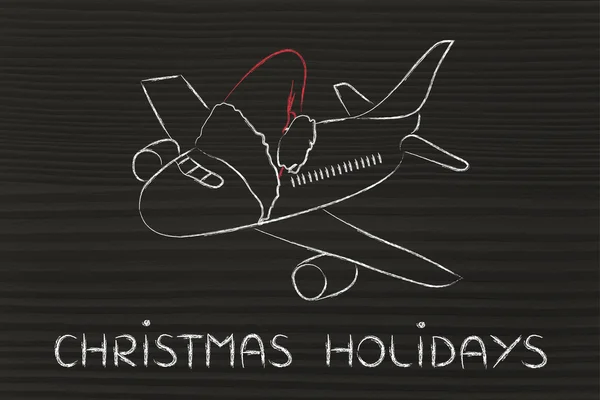 Winter and Christmas holiday: plane with santa claus hat — Stock Photo, Image