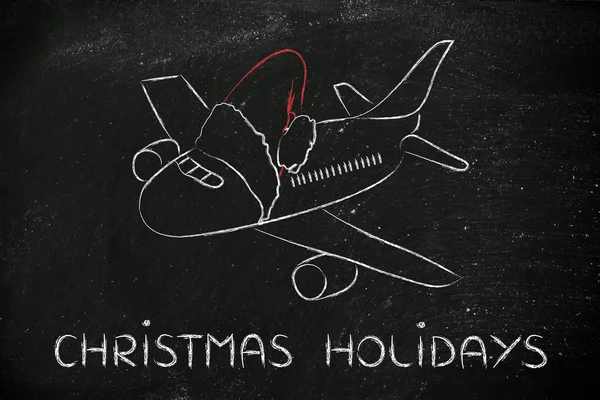 Vacaciones de invierno y Navidad: avión con sombrero de Santa Claus — Foto de Stock
