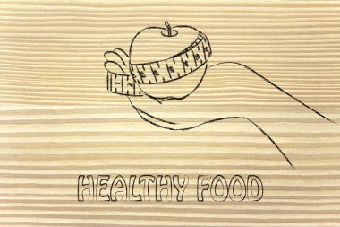 Teyp ölçme ile elma tutan el