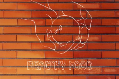 Teyp ölçme ile elma tutan el