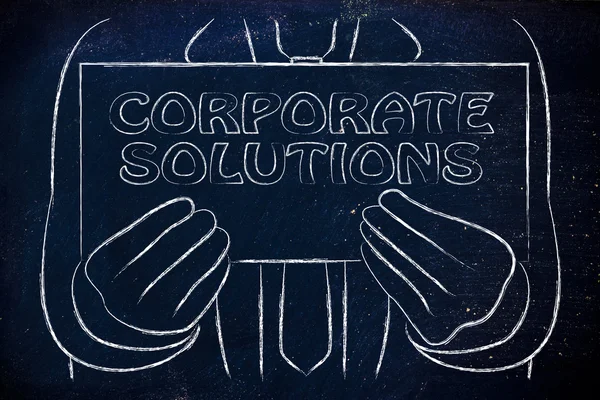 Man holding Corporate Solutions sign — Stock Photo, Image