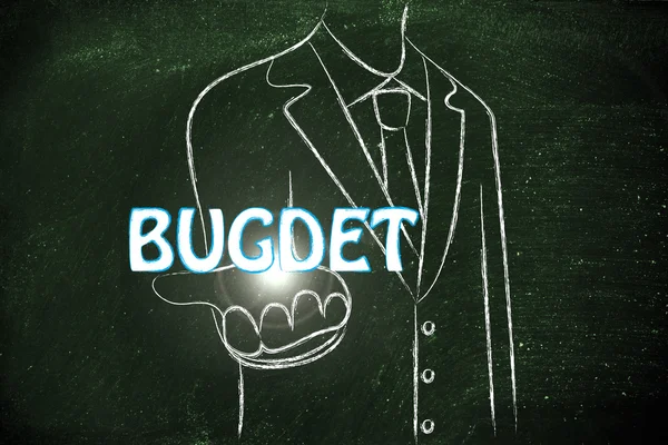 Business man handing out the word Budget — Stock Photo, Image