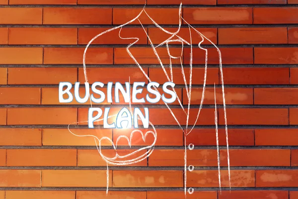 Бизнесмен со словом Business Plan — стоковое фото