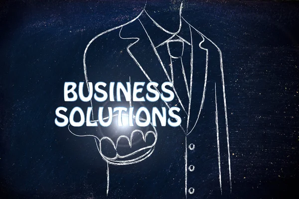 Zakenman die het woord Business Solutions — Stockfoto