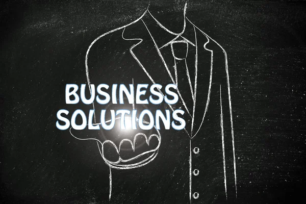 Business man holding the word Business Solutions — Stock Photo, Image