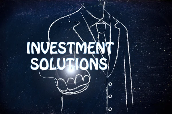 Business man handing out the word Investment Solution — Stock Photo, Image