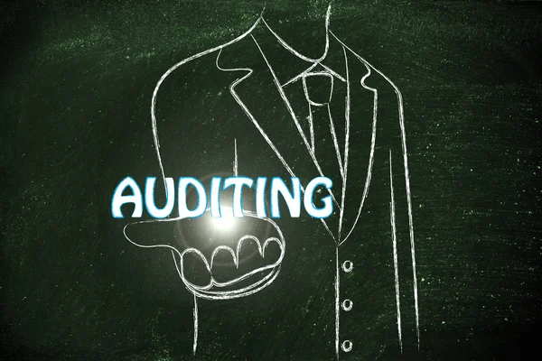 Business man handing out the word Auditing — Stock Photo, Image
